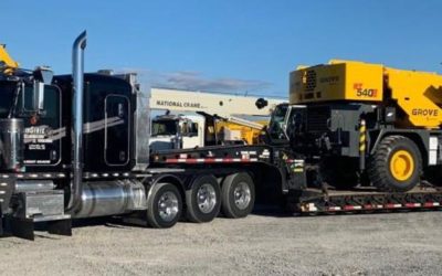 Midstate Companies truck hauling a rough terrain crane.