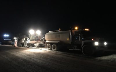 Midstate conducting soil stabilization at night.