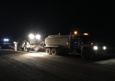 Midstate conducting soil stabilization at night.